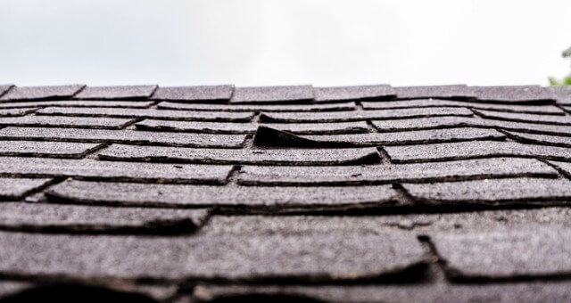 damaged tiles and curling