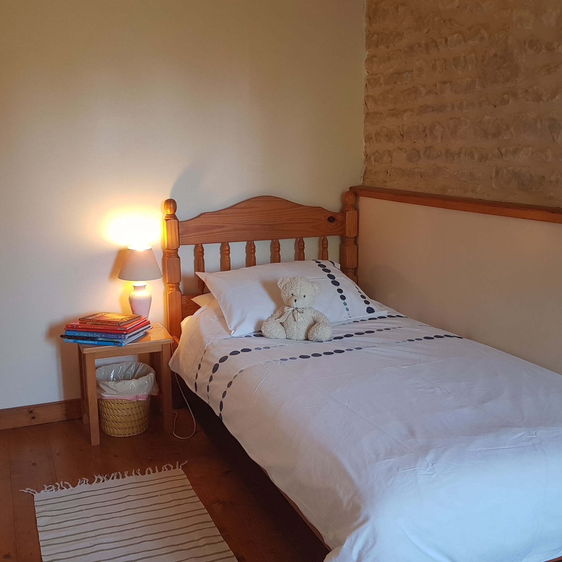 single bed with white bedding