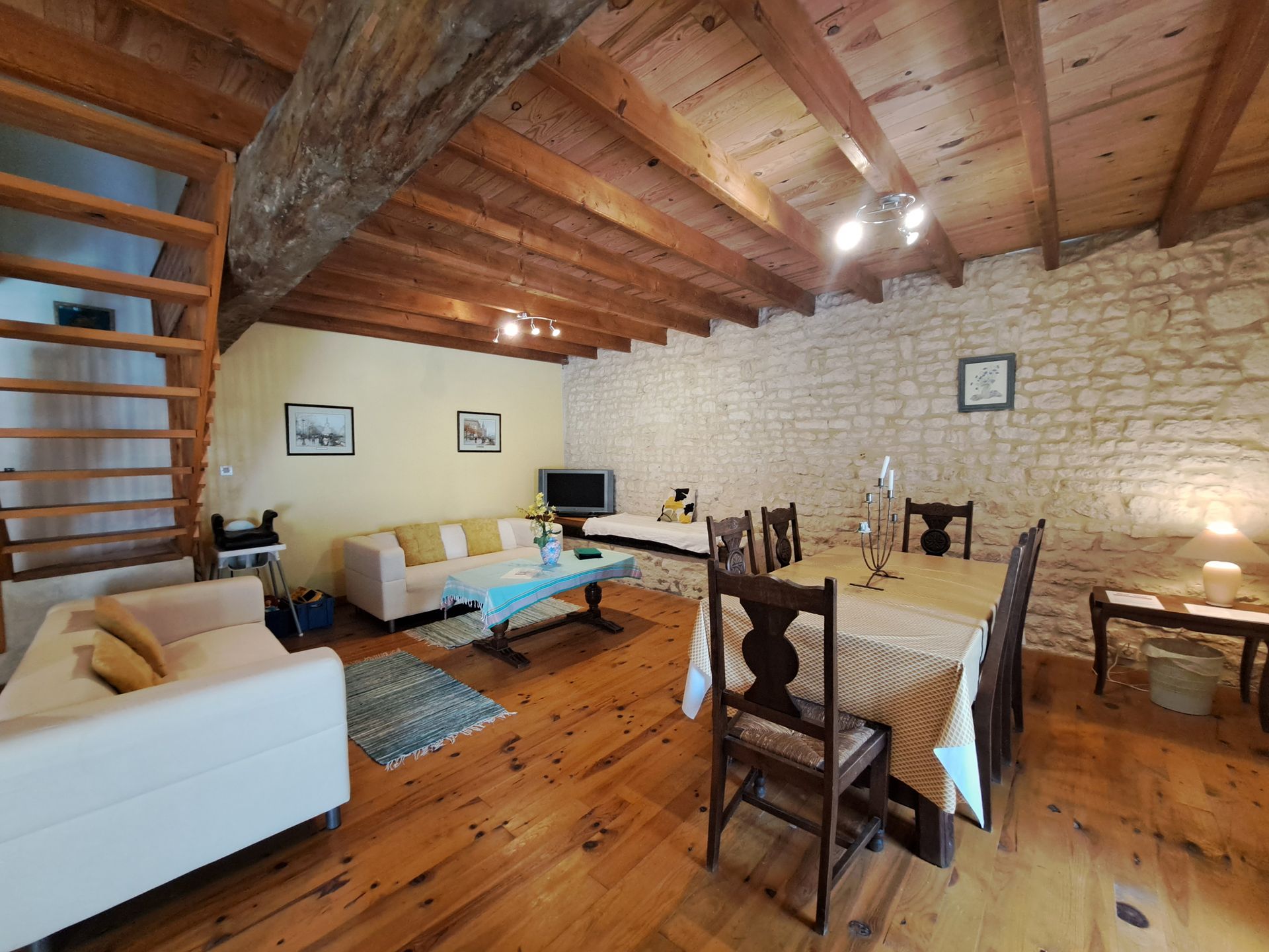 sitting room with dining table with dark wooden chairs