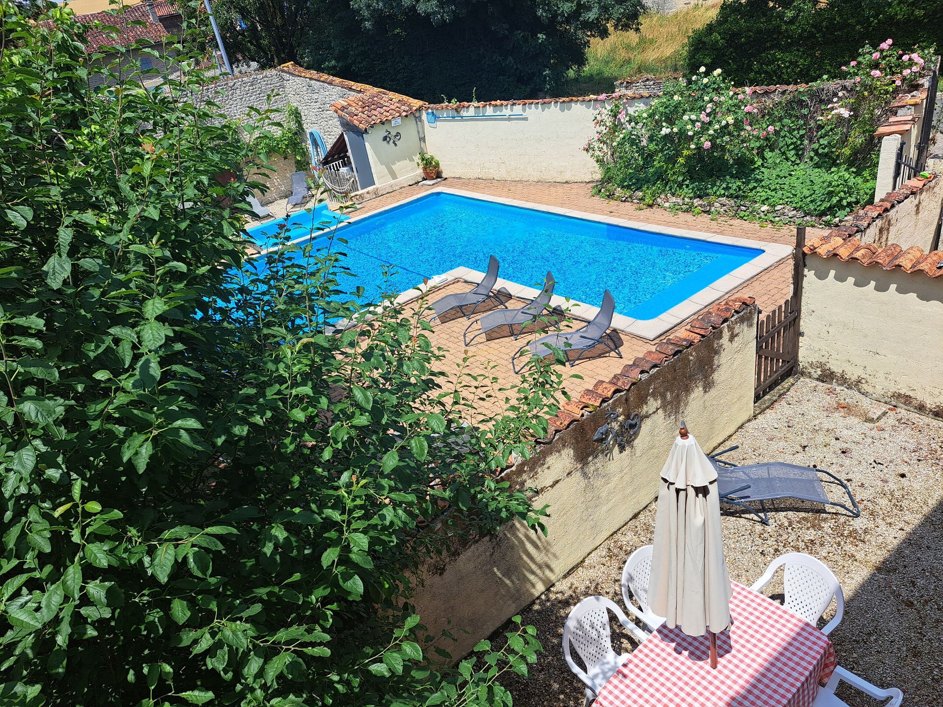 view of swimming pool from second floor window of holiday cottage
