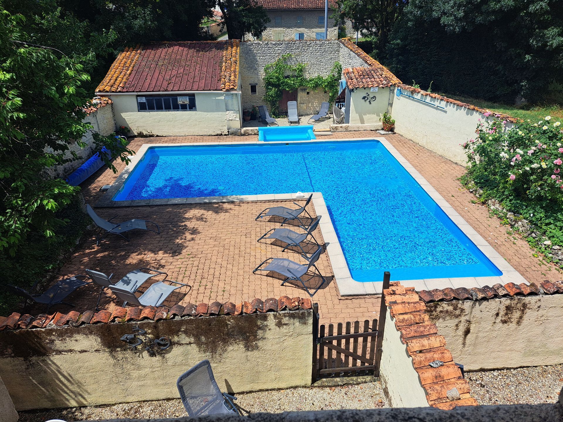 aerial shot of an L shaped pool
