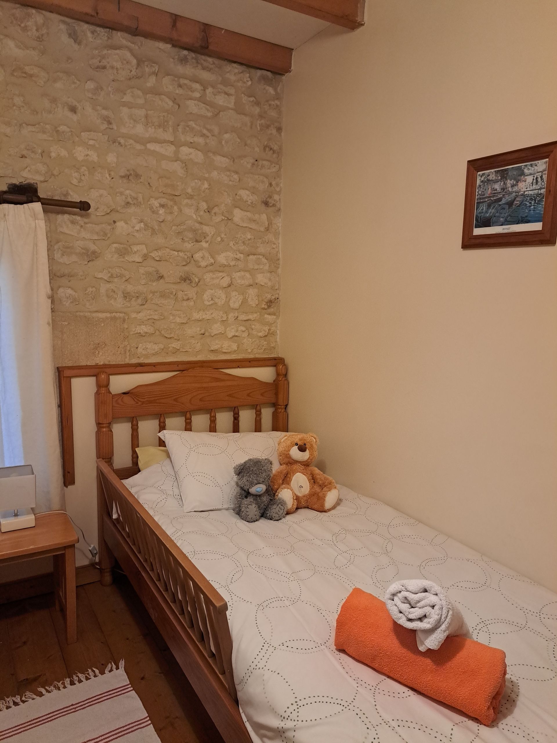single bed with wooden bedguard