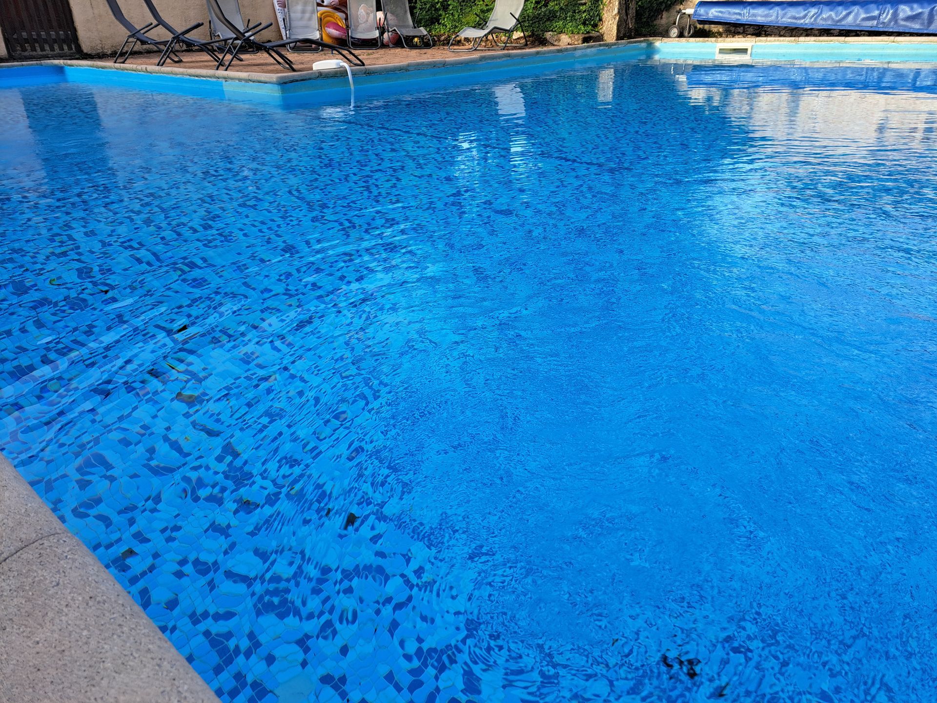 surface of a blue swimming pool