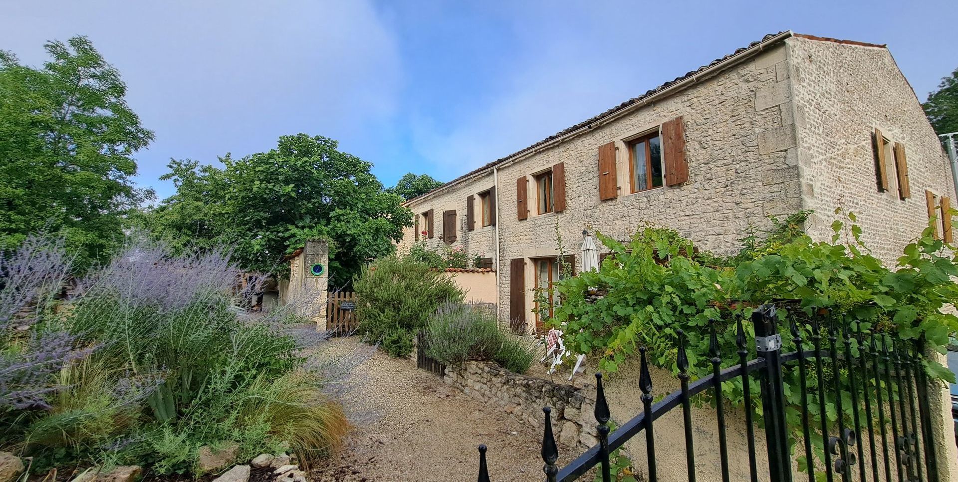 stone holiday cottage with wooden shutter