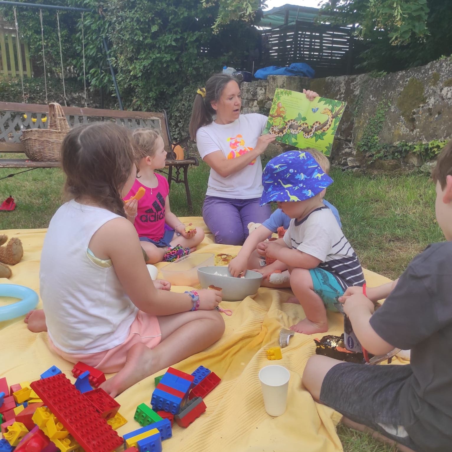 children listening to a lady tell a story