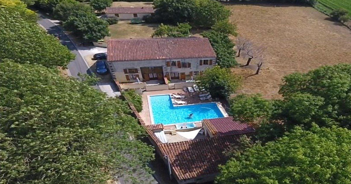 aerial view of Les Vallaies domain in France surrounded by trees and fields