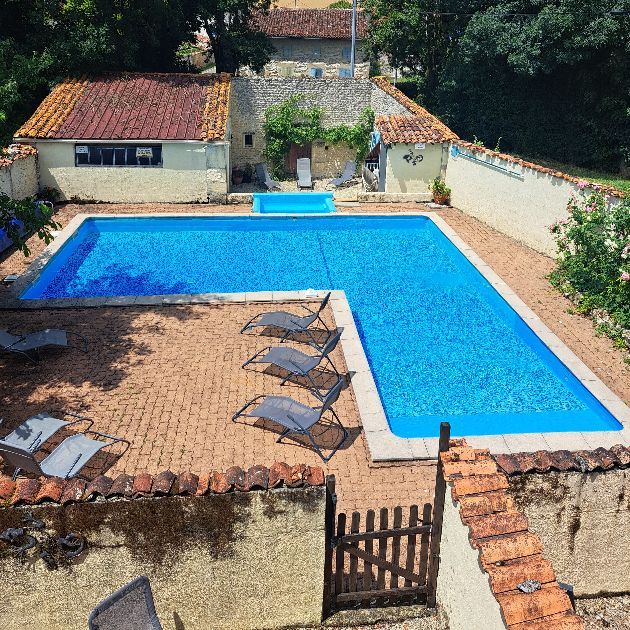 Looking down on an L shaped swimming pool from above