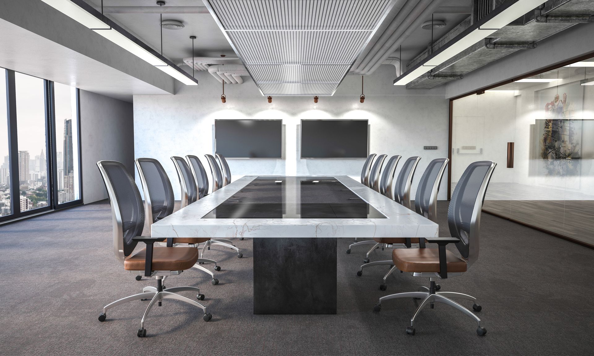 A conference room with a long table and chairs.