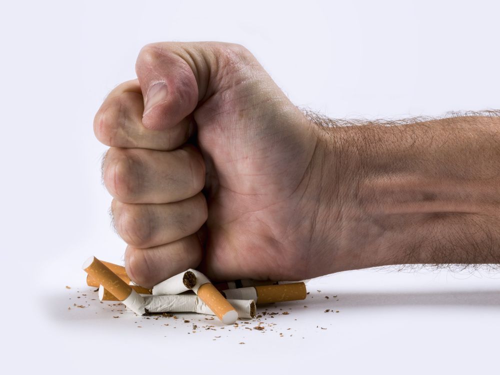a Person is Refusing a Pack of Cigarettes From Another Person — Warners Bay Pharmacy In Warners Bay, NSW