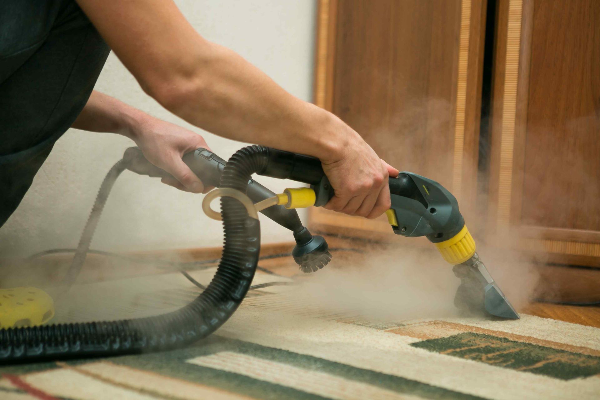 Steam cleaning a carpet