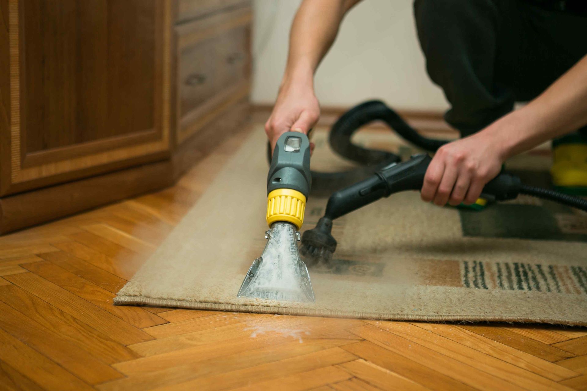 Steam cleaning a rug