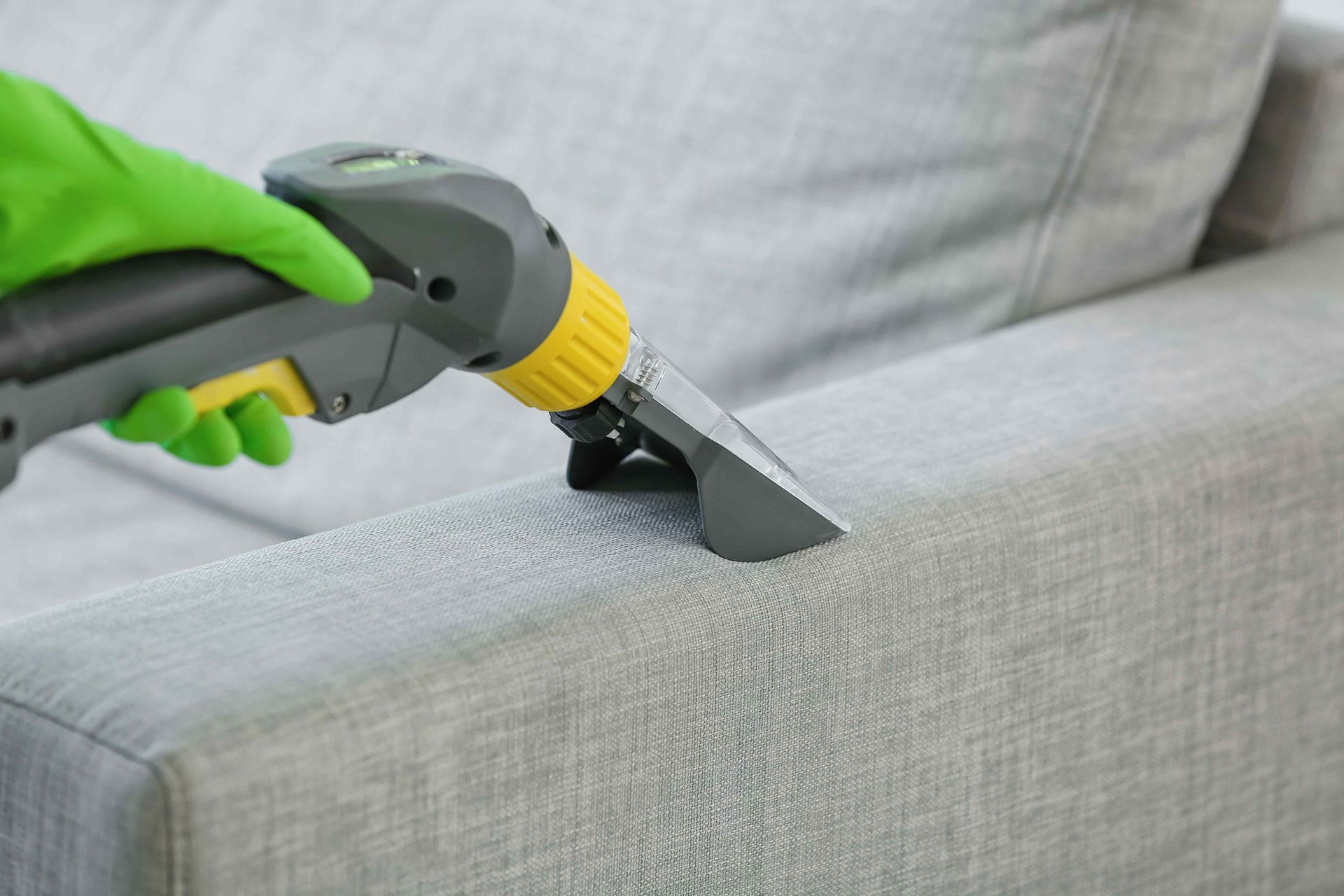 Deep cleaning a sofa arm