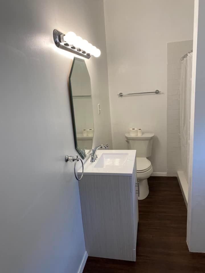 Bathroom lighting installation above vanity mirror