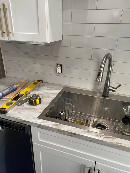 Plumbing fixture installation and light plumbing repairs in a kitchen