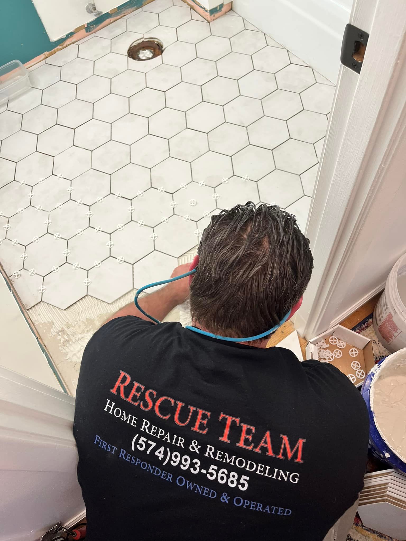 Bathroom tile floor installation during a home repair project