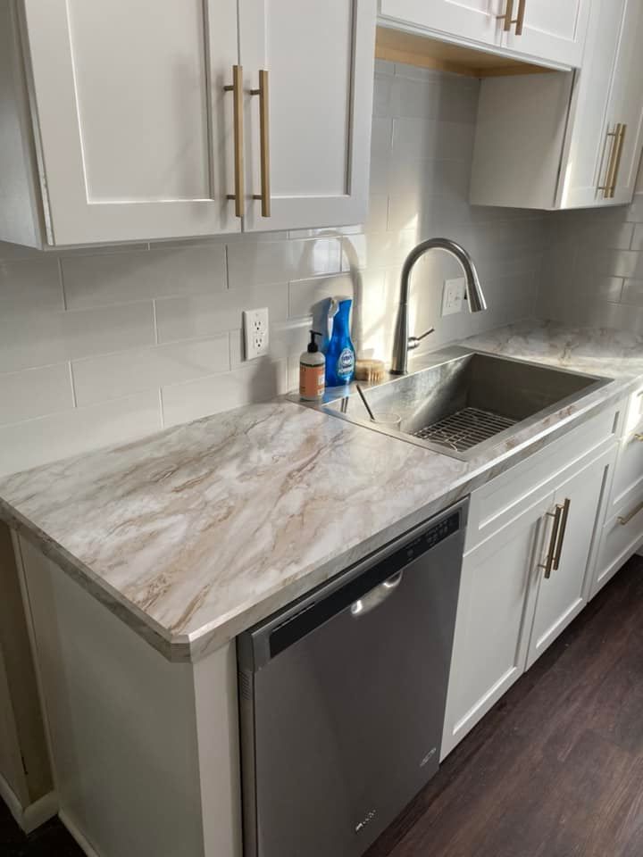 Kitchen sink and countertop installation with modern fixtures
