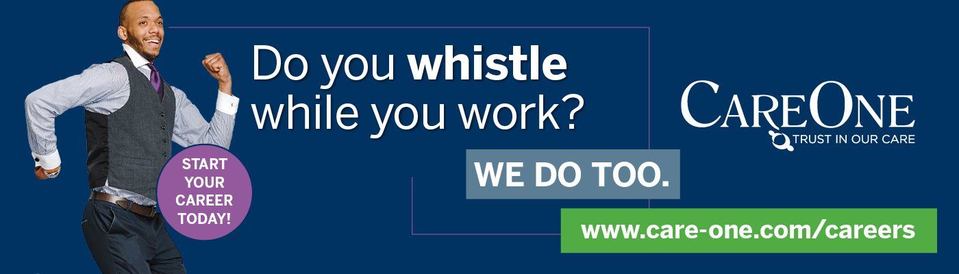 A man is standing in front of a blue background that says do you whistle while you work
