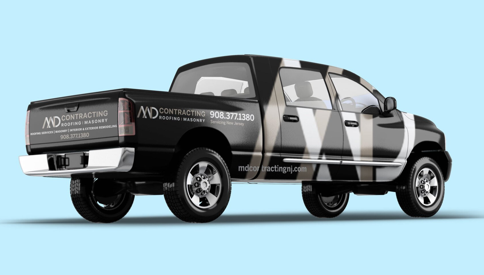 A black truck with a MD contracting white logo on the back