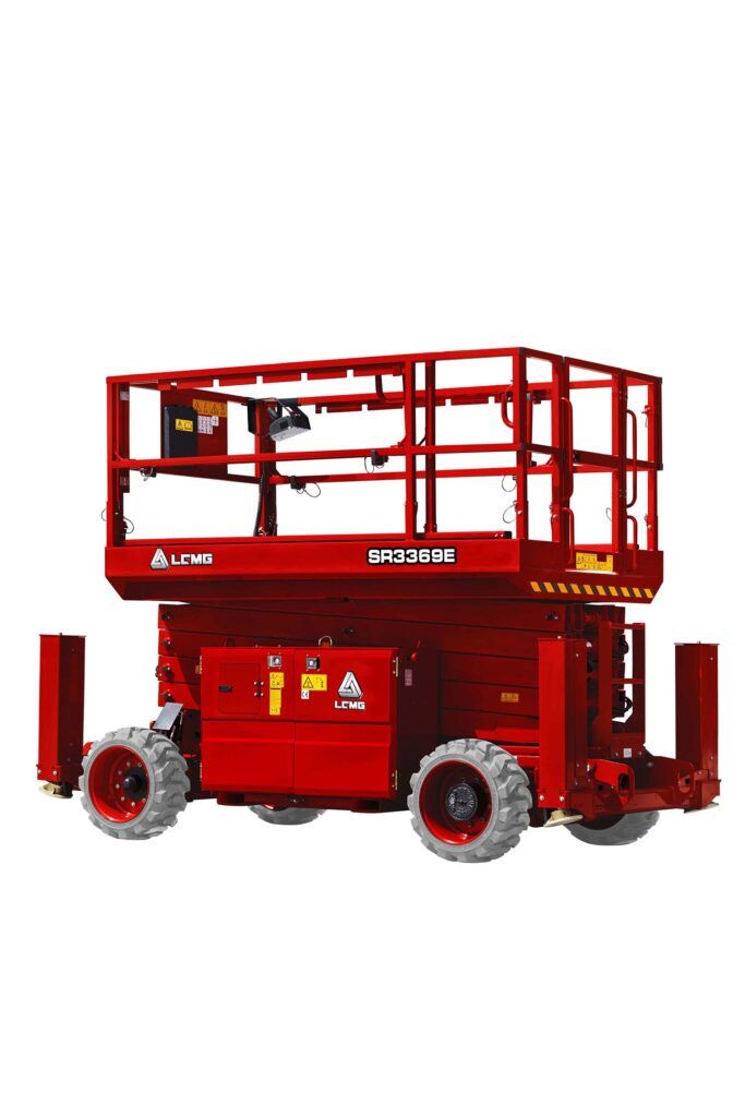 Red electric scissor lift with extended platform and guardrails, isolated on a white background