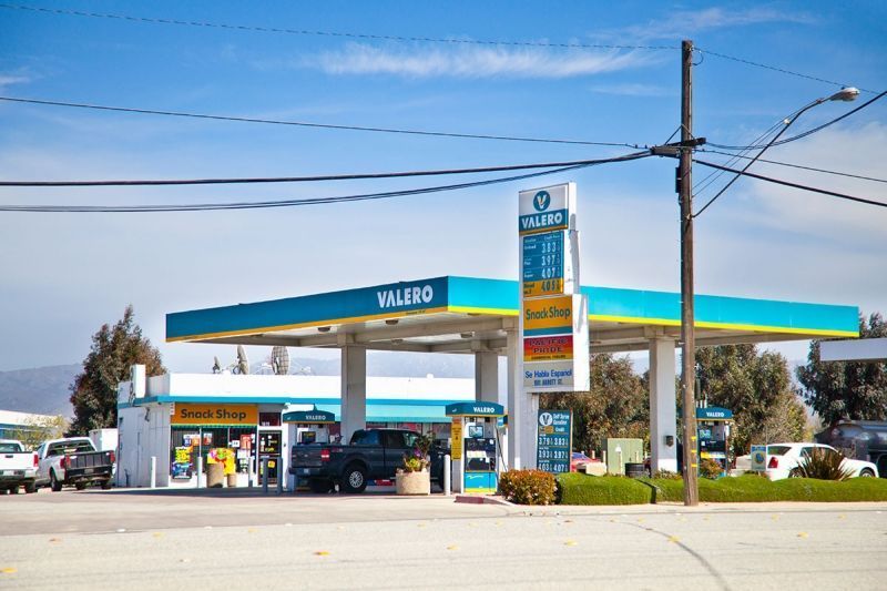 A gas station with a sign that says Valero on it