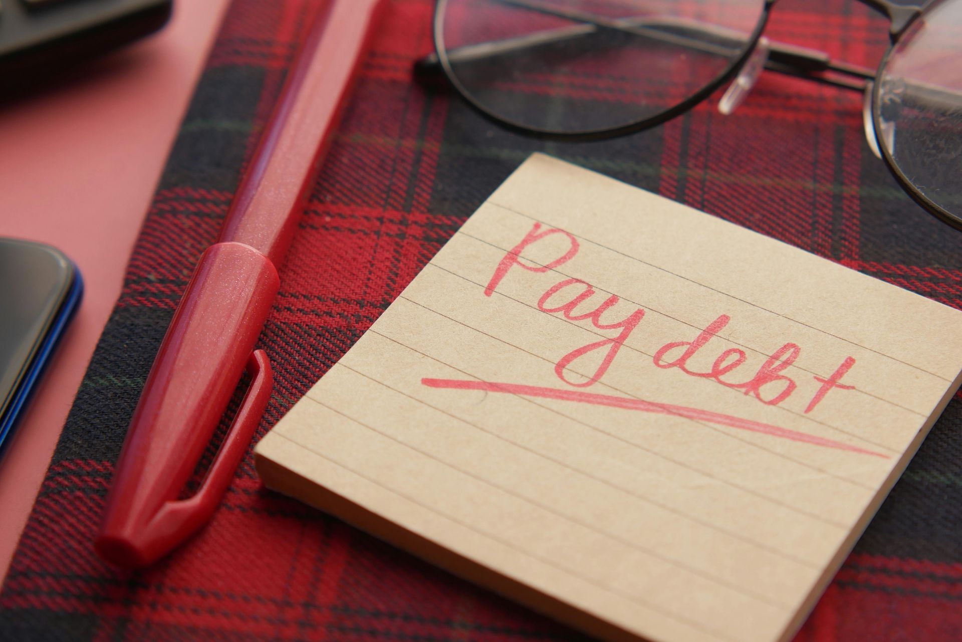 Pay debt reminder note - student loan planning and debt relief concept