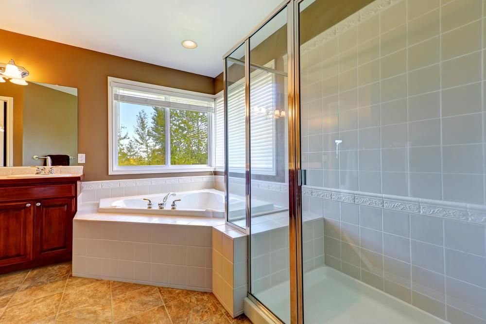 A Bathroom with A Tub and A Walk in Shower — Distinctive Glass In Forster, NSW