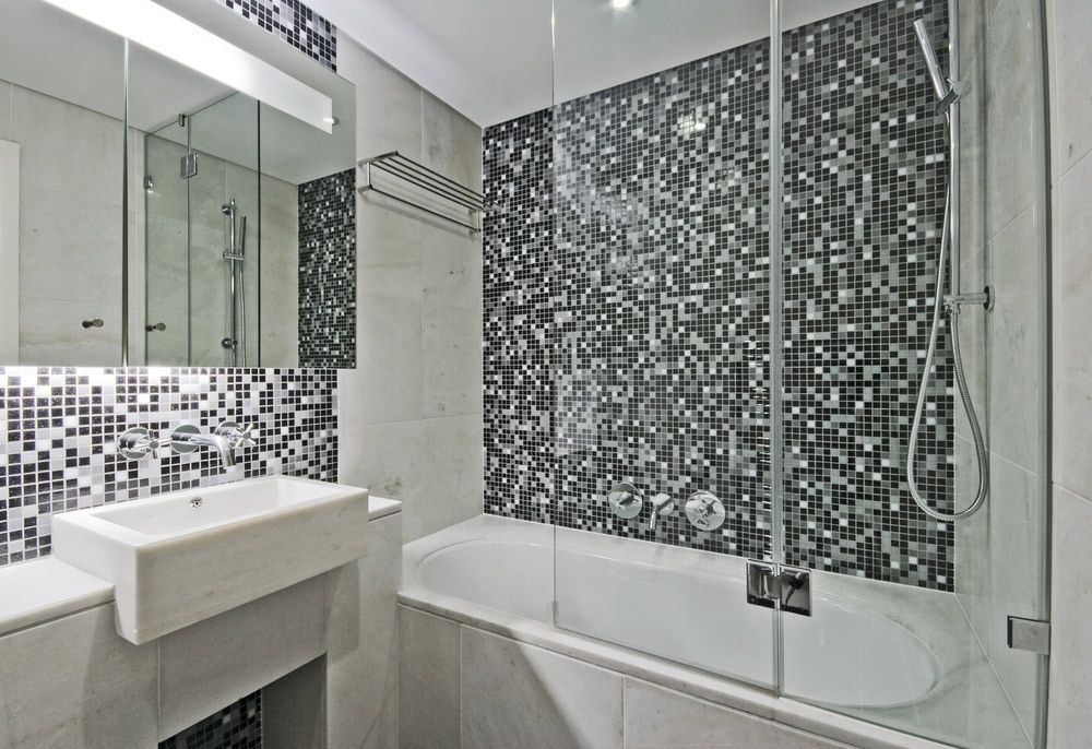 A Bathroom with A Sink and A Bathtub with A Glass Shower Door — Distinctive Glass In Nambucca Heads, NSW
