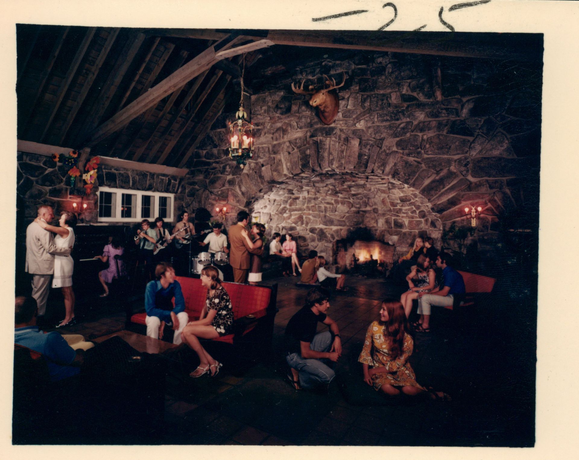A group of people are gathered in the Tavern before it was the Tavern