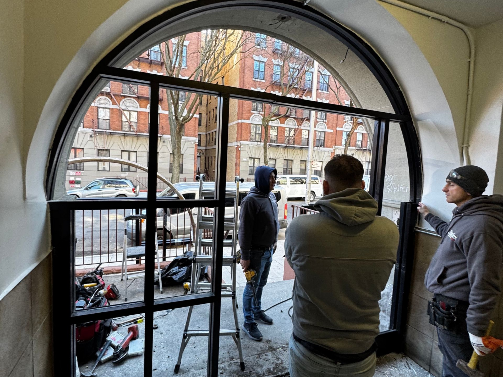 installing a new storefront door system with custom arch in Brooklyn NY