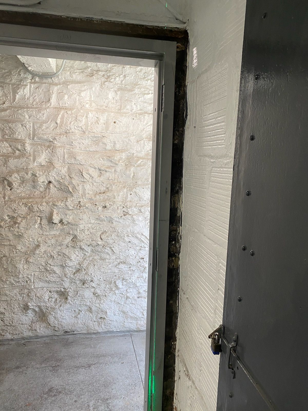 Cement work completed for door framing at an apartment building in Long Island City, Queens
