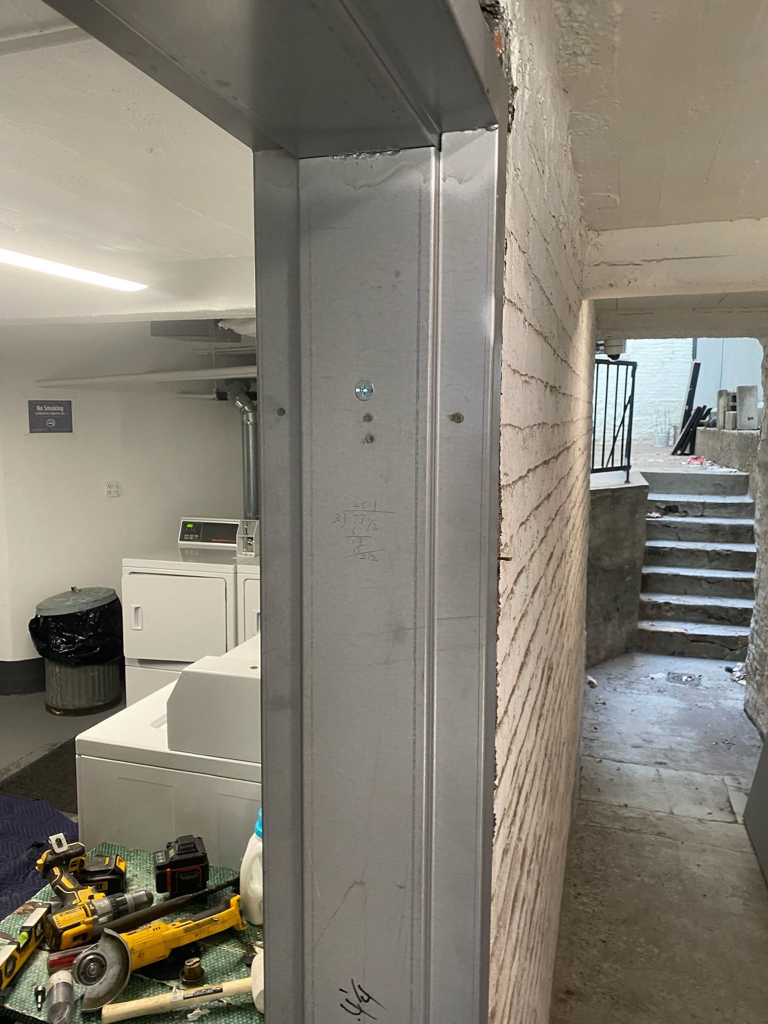 Installed door framing for metal door at an apartment building in Long Island City, Queens