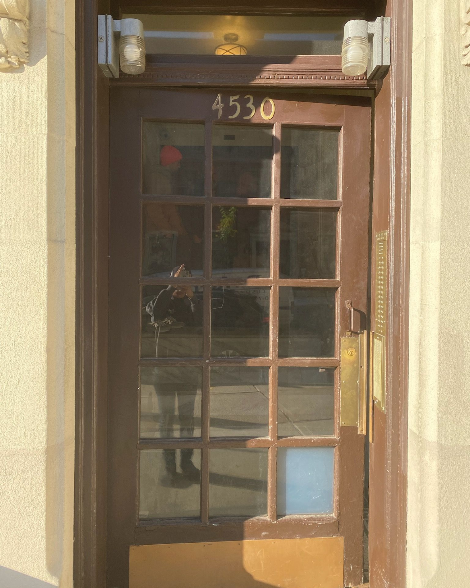 Old front door at an apartment building in Long Island City, Queens