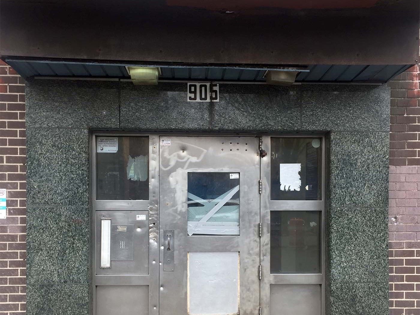 Existing storefront door at apartment building in The Bronx
