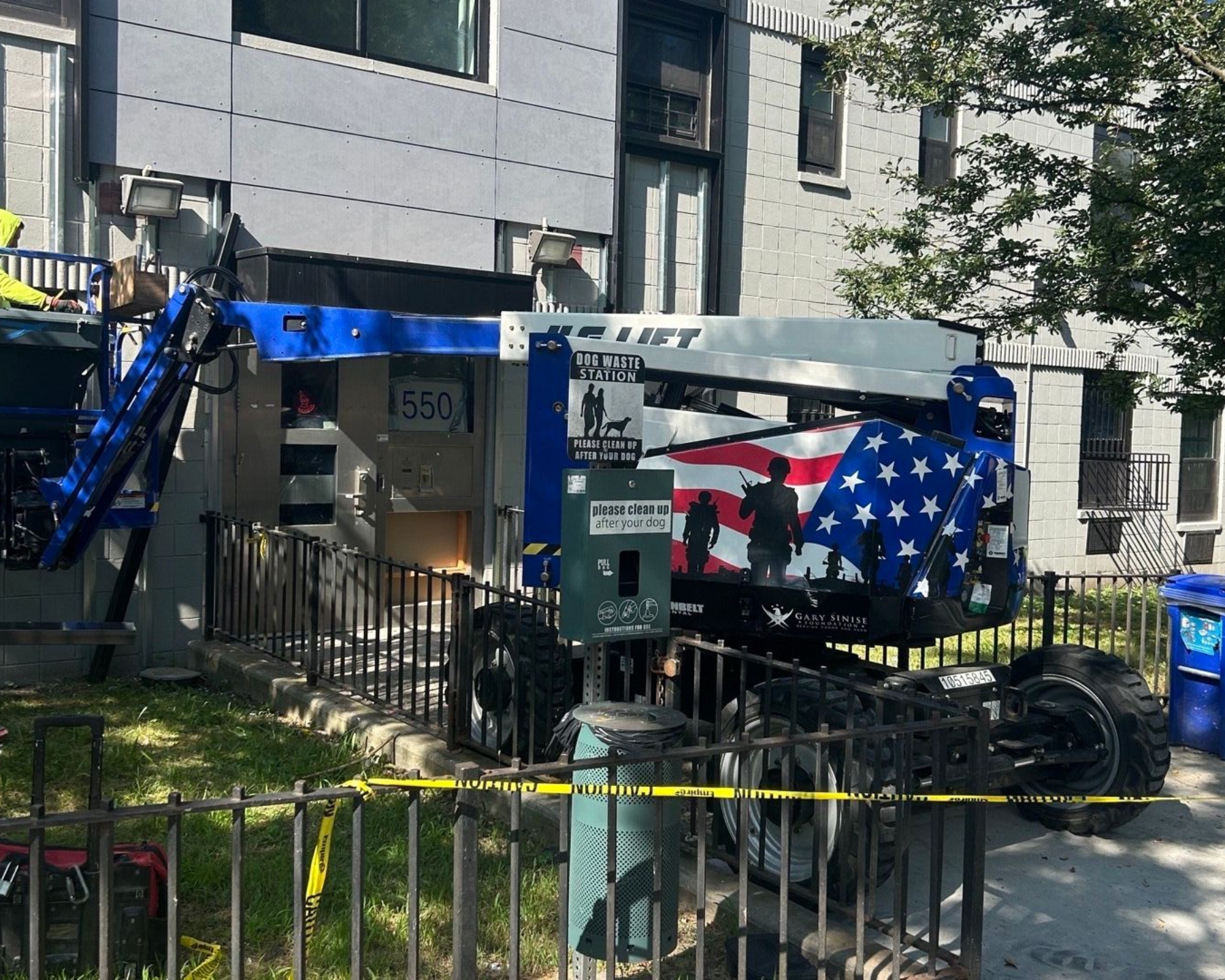 Boom lift staged for energy-efficient window installation at a Bronx apartment building by Parker Custom Security