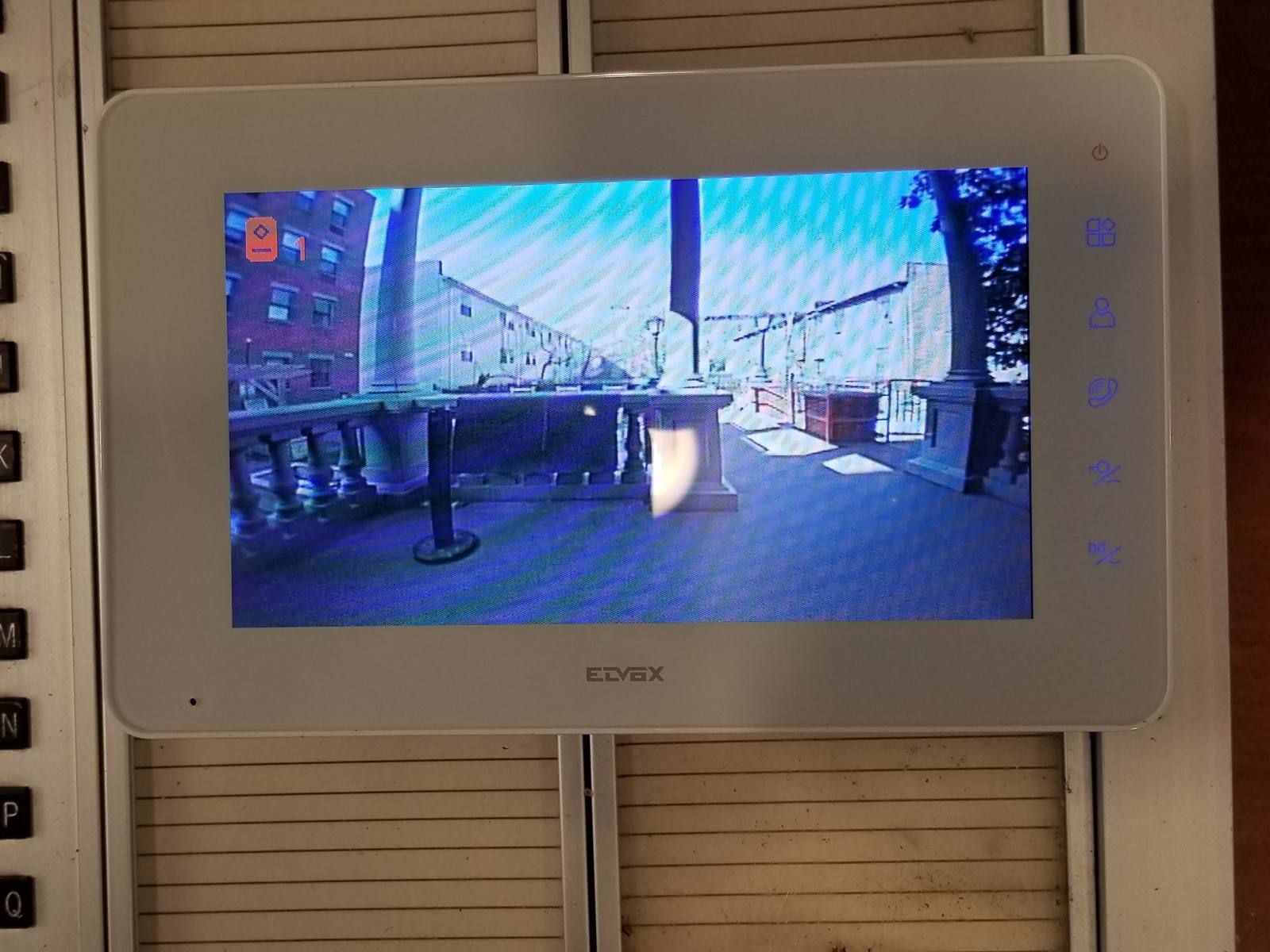 Elvox indoor video intercom monitor showing the outdoor camera view at a Bed-Stuy, Brooklyn apartment building