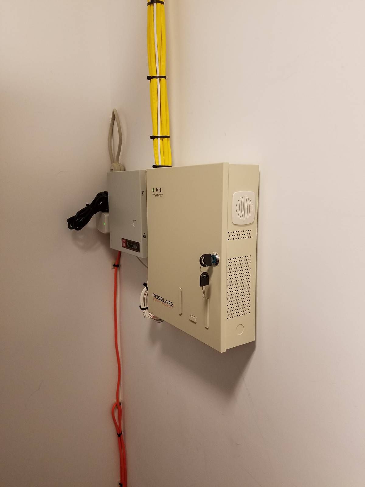 Locked access control panel and dedicated power supply mounted in a secure room at a West Orange, NJ church
