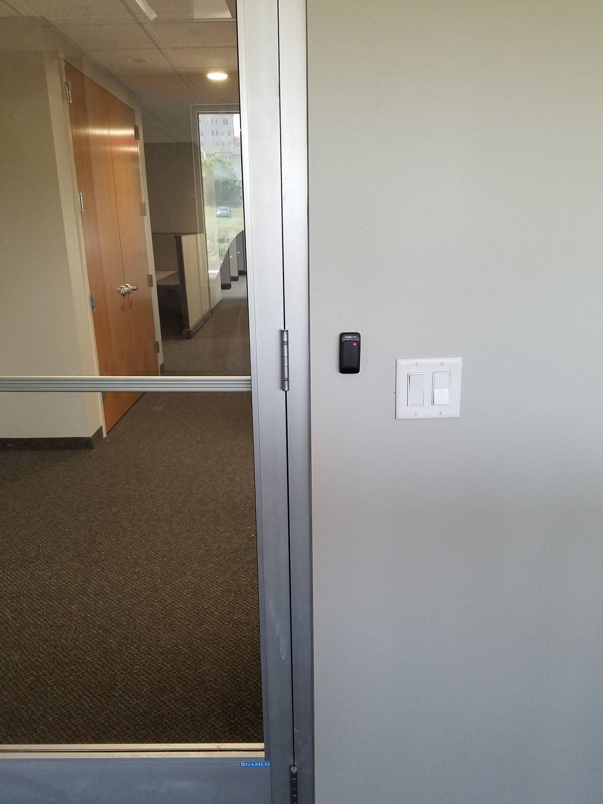 Card reader at a glass office suite door in a West Orange, NJ church building