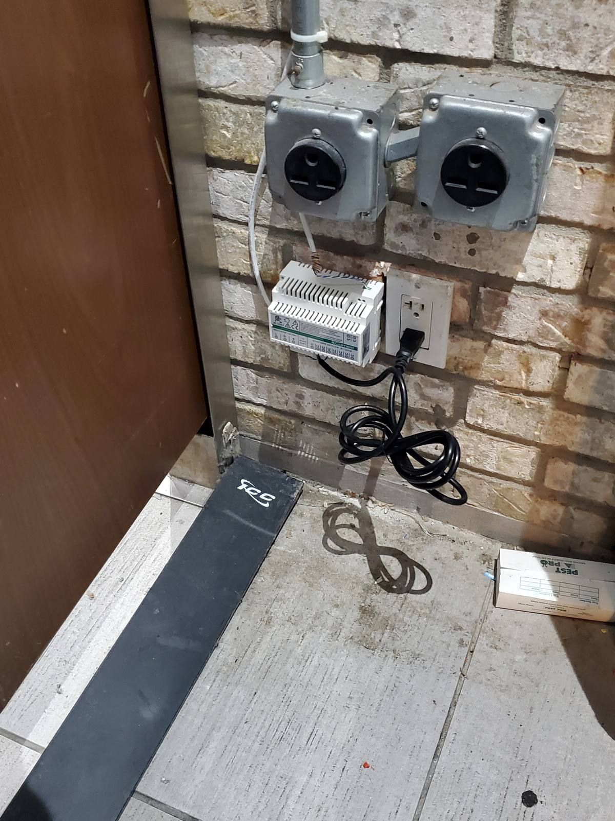 Comelit intercom power supply and connections installed in a back-of-house area at a NYC hotel