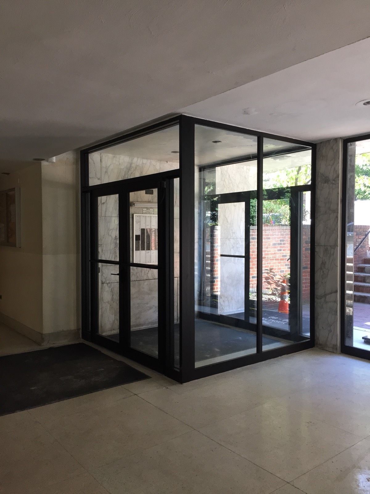 Interior view of new vestibule entrance doors and hardware in Flushing, Queens