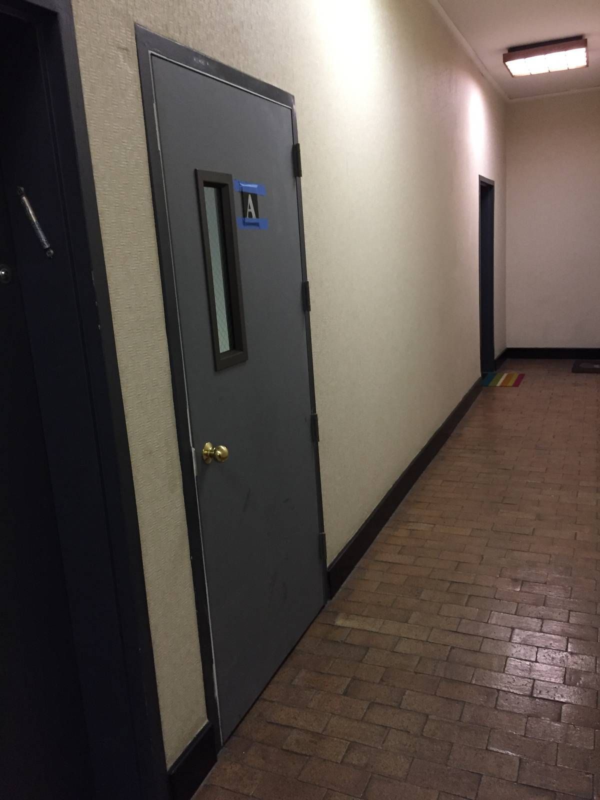 Corridor side of the new hollow metal Stair A exit door at 325 West 52nd Street, Hell's Kitchen