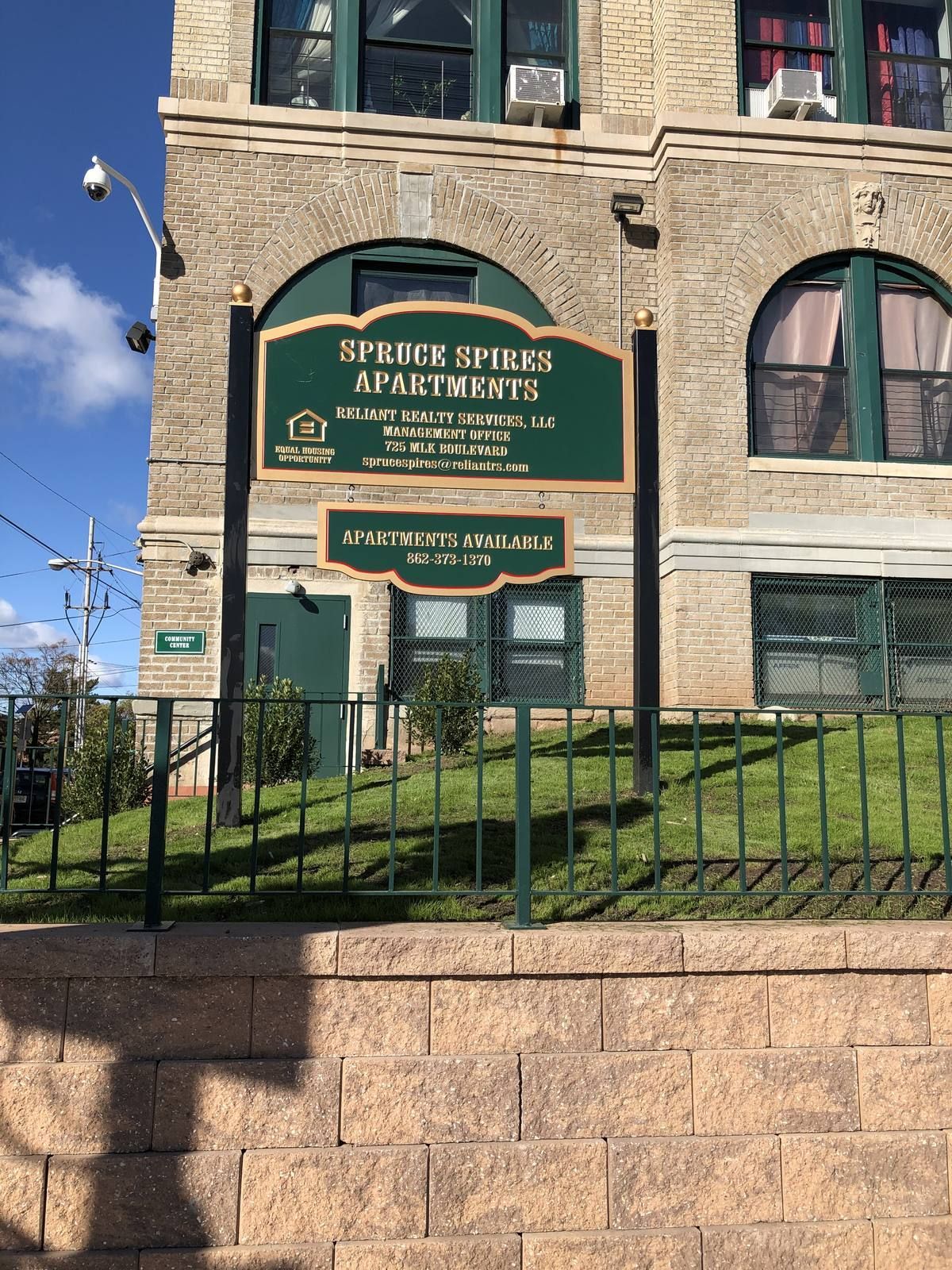 Spruce Spires apartment building exterior in Newark NJ with new storefront entrance and ground-floor window systems