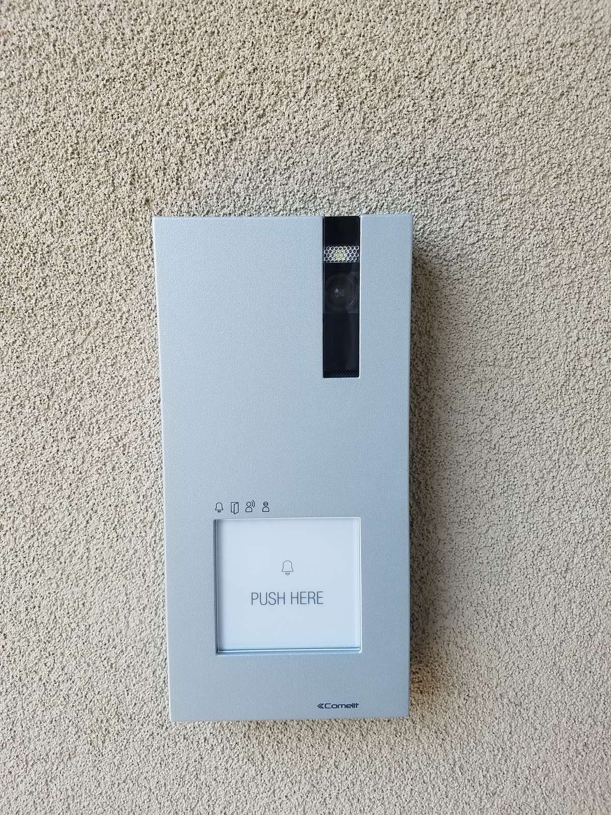 Surface-mount video intercom door station with camera and push-to-call button at a West Orange, NJ church