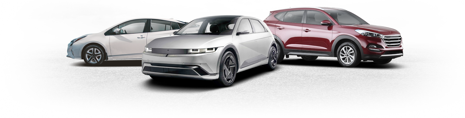 Three cars on a white background: silver sedan in front, white sedan left, red SUV right | Browncroft Garage