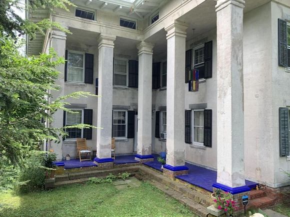 The House - a rare stucco Italianite style villa - was built in 1841