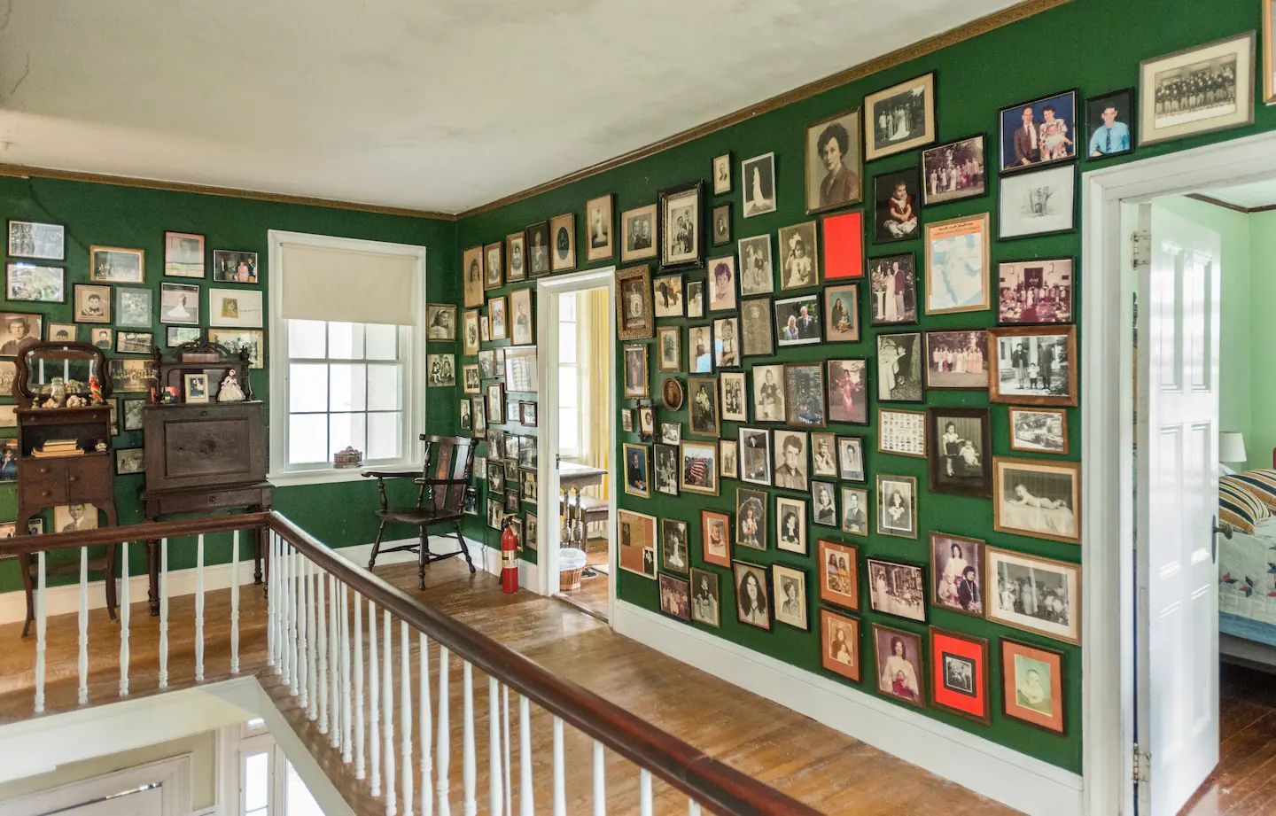 There are a lot of pictures on the wall in this room.