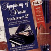 A symphony of praise volume 2 cd is sitting on a table next to a piano.
