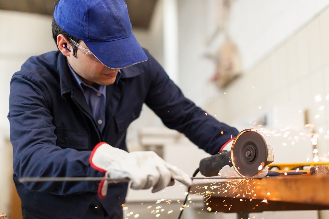 employee wearing custom earplugs at work