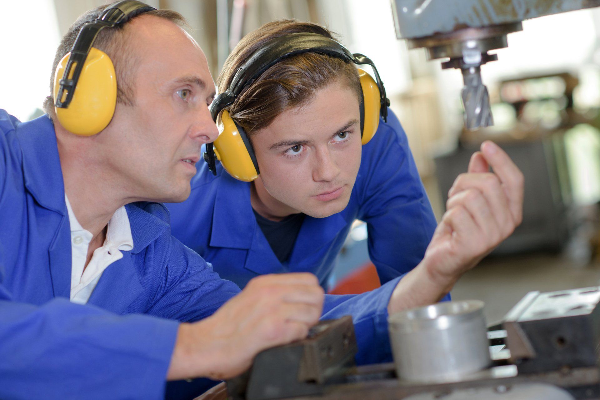 Two men wearing earmuffs