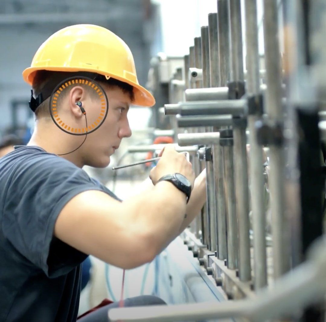 Man wearing custom hearing protection at work