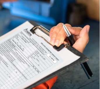 Employee holding hearing conservation hearing testing checklist